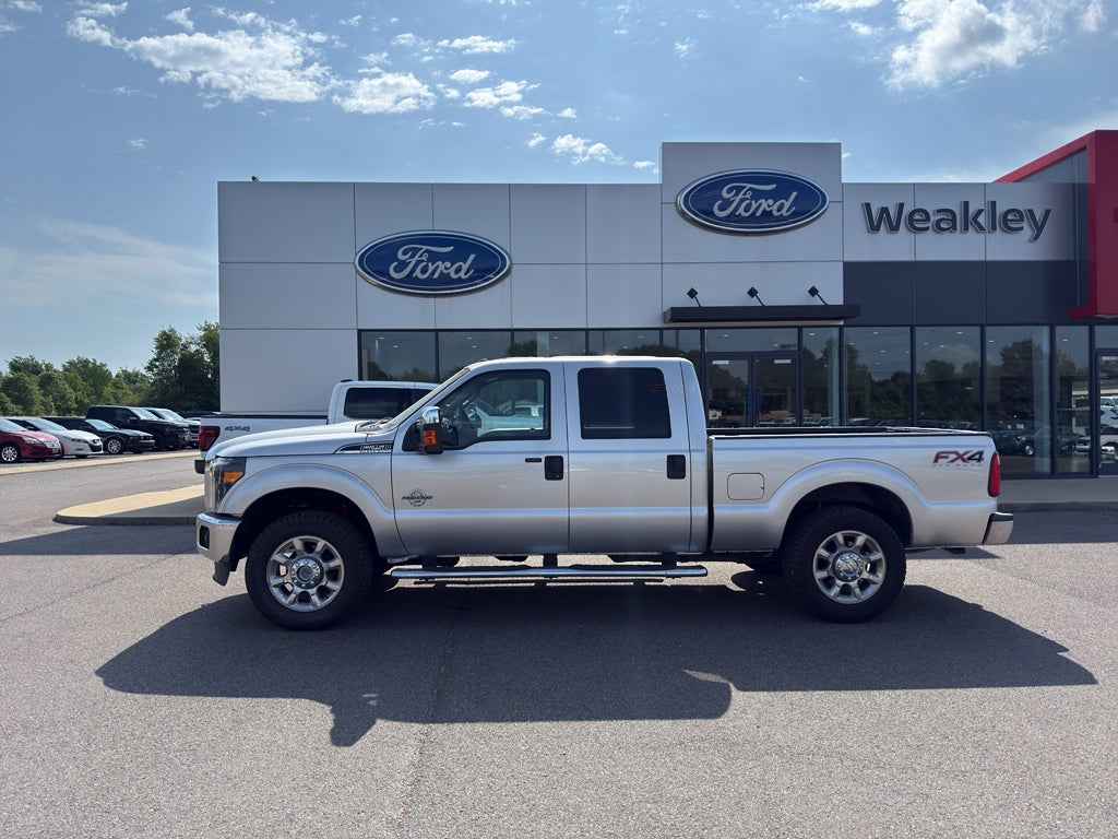2015 Ford F-250 XLT in Ingot Silver Metallic — front three-quarter view